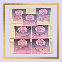 a set of bracelets with the word p a l on them